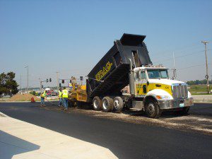 Image of truck dumping gravel