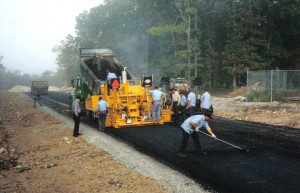 Image of road getting asphalt paving done