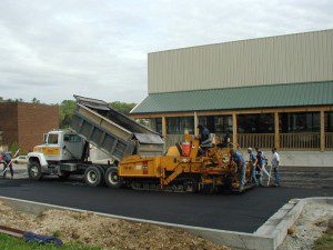 Image of truck dumping gravel