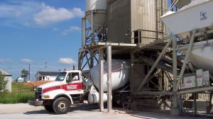 Image of truck getting loaded with concrete