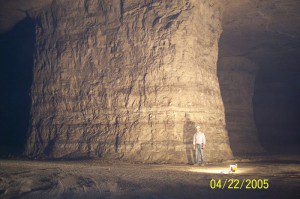 Image of a man inside a large cave